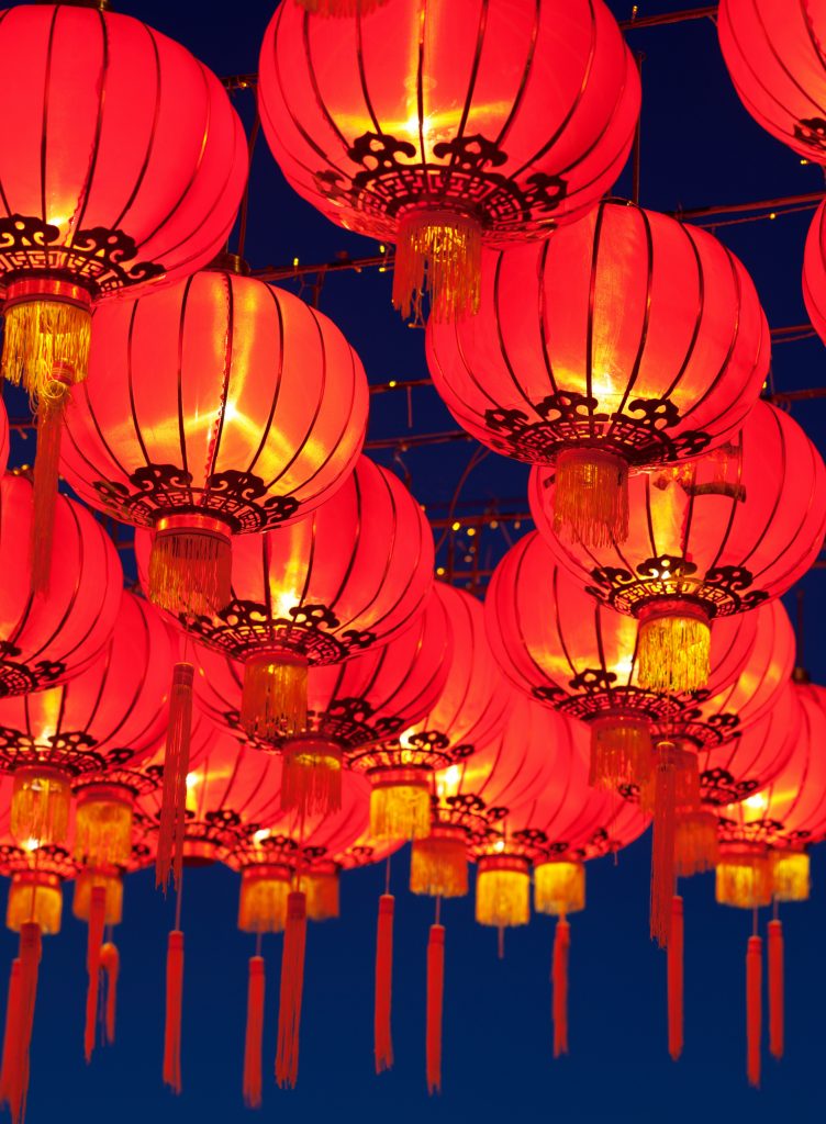 Red lanterns lit against a dark background